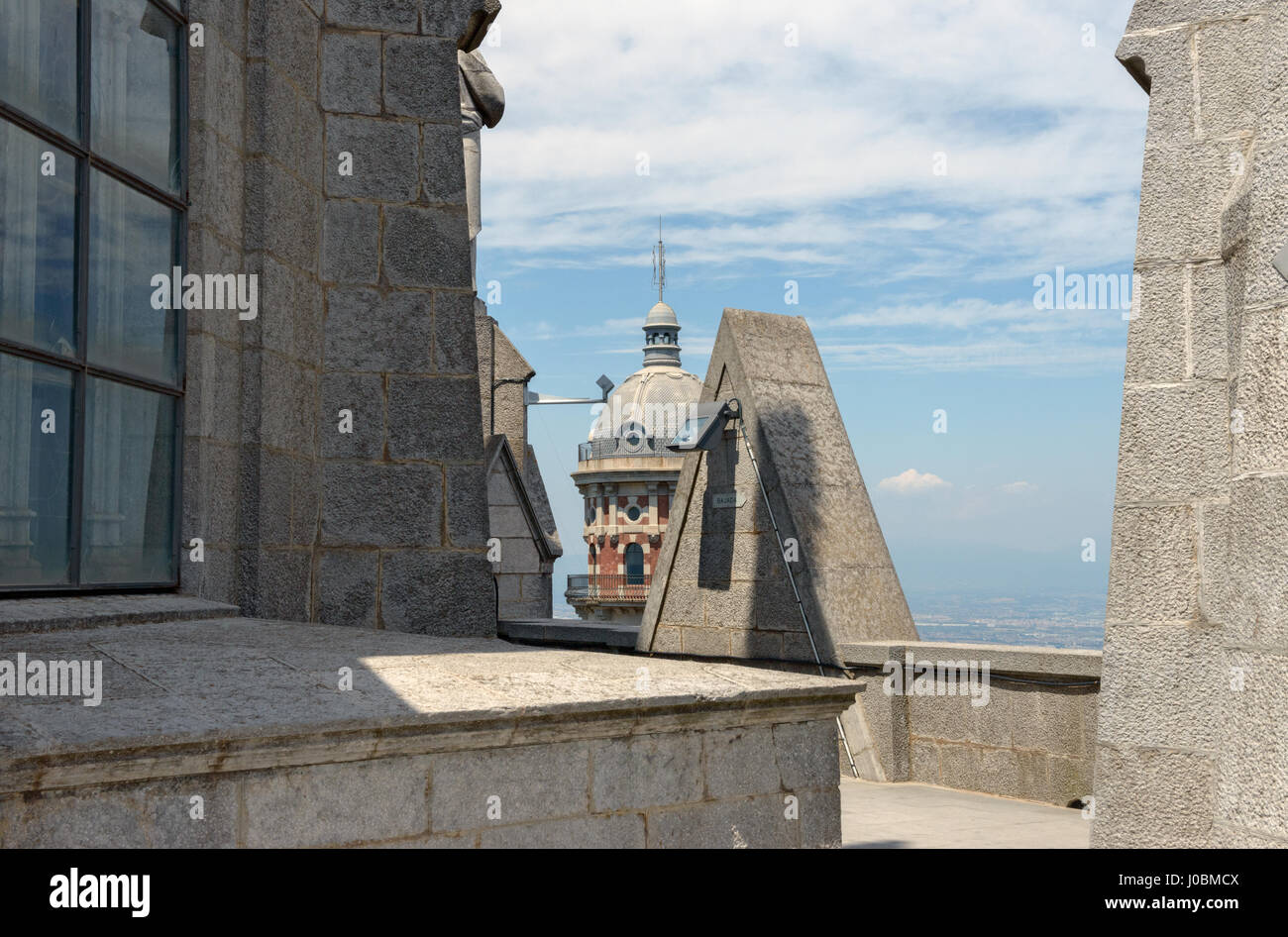 View from observation deck of Sagrat Cor (Sacred Heart of Jesus) Temple towards upper part of old grand water deposit tower on Tibidabo mountain, Barc Stock Photo