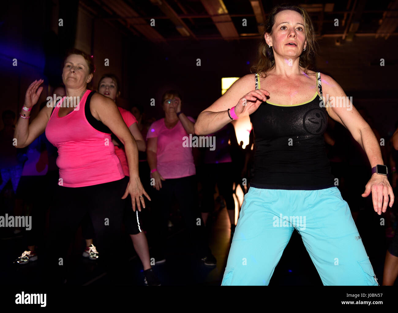 Women taking part in a Charity Zumbathon for Cancer Research, Alton, Hampshire, UK. 1 April 2017. Stock Photo