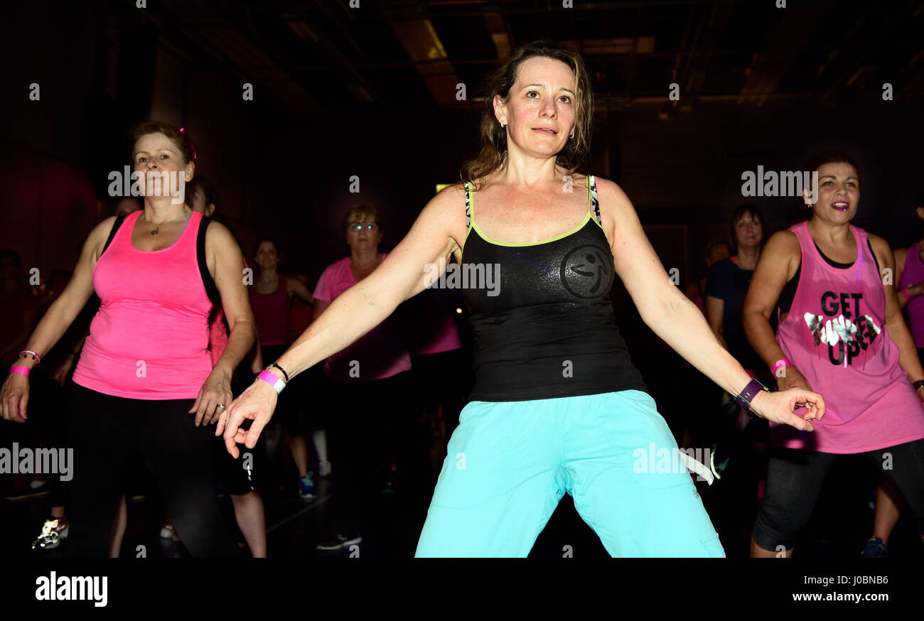 Women taking part in a Charity Zumbathon for Cancer Research, Alton, Hampshire, UK. 1 April 2017. Stock Photo