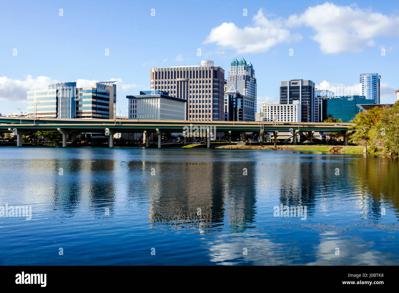 Orlando Florida,Lake Lucerne,downtown,view,water,reflection,office buildings,highway bridge,city skyline,FL170222172 Stock Photo