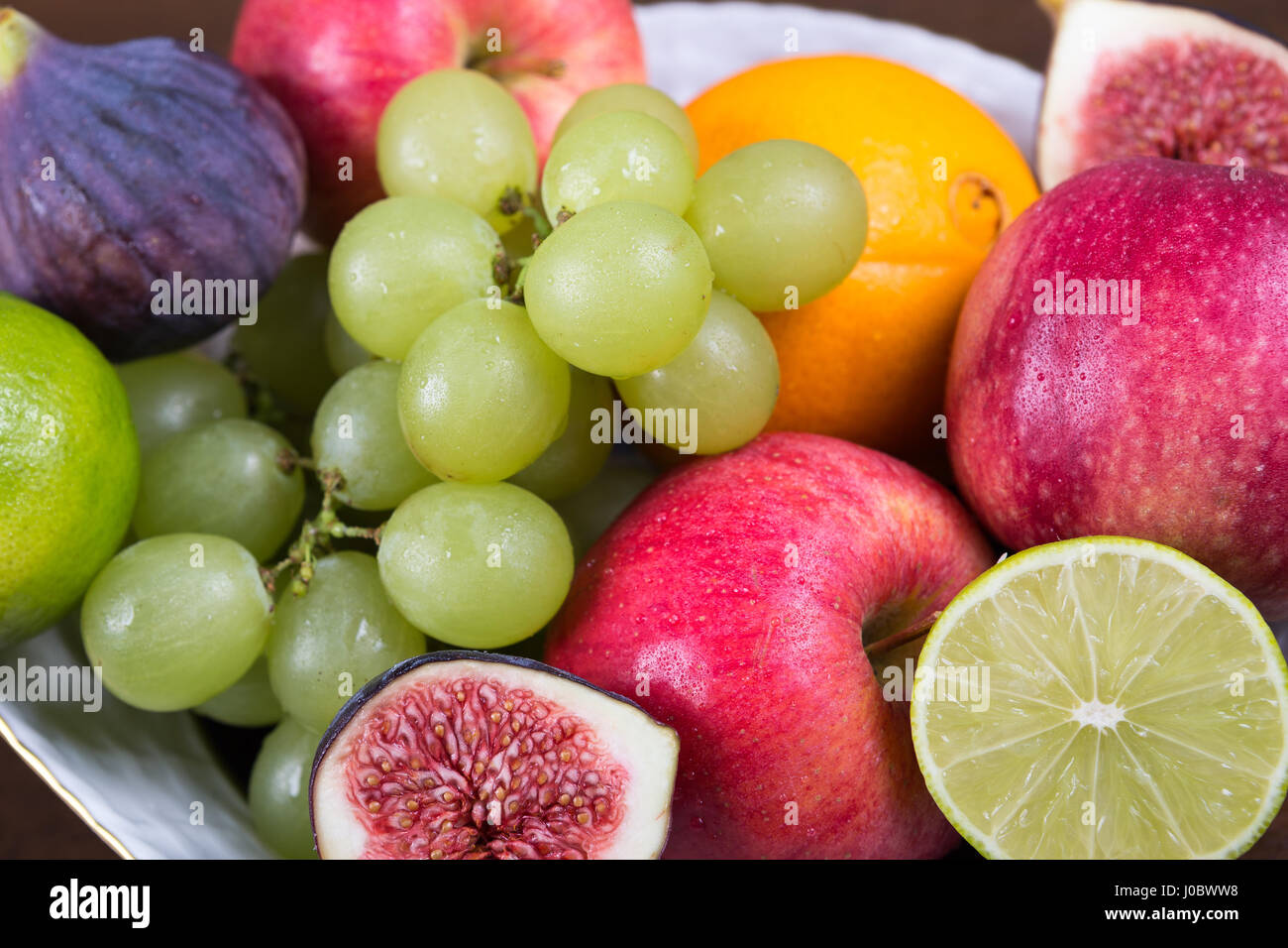 Assortment fruits on wooden table Stock Photo - Alamy