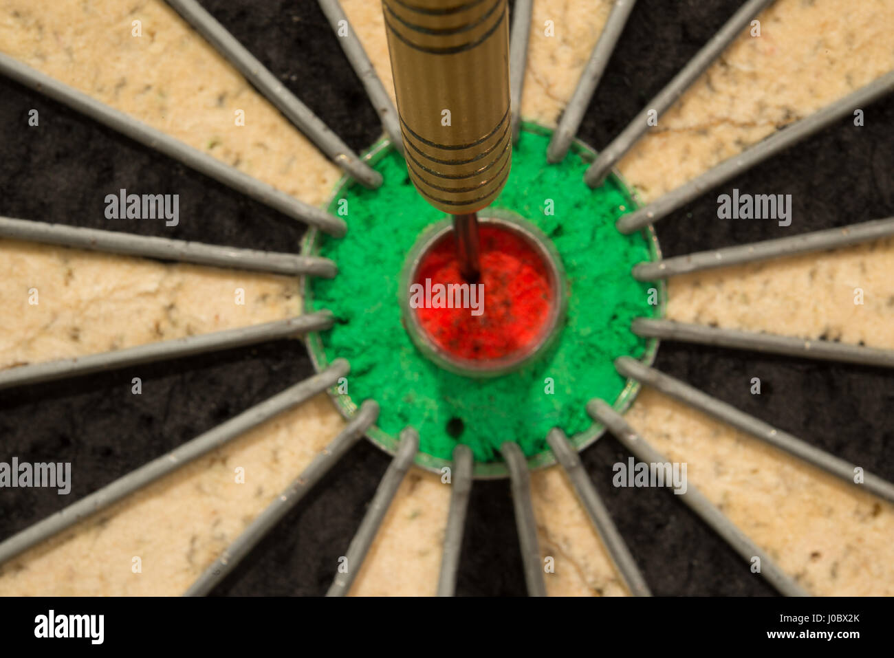 A dart the bulls eye of a UK dart Board 50 points Stock Photo - Alamy