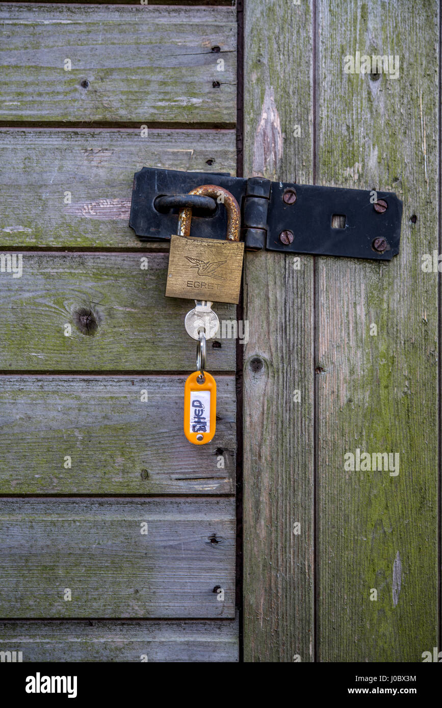 Padlock Securing Padlock securing shed Stock Photo - Alamy