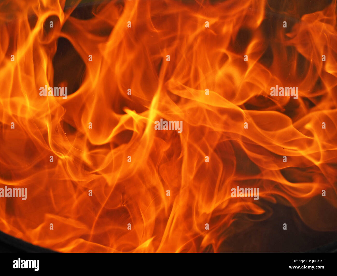 dramatic pattern of swirling bonfire flames Stock Photo - Alamy