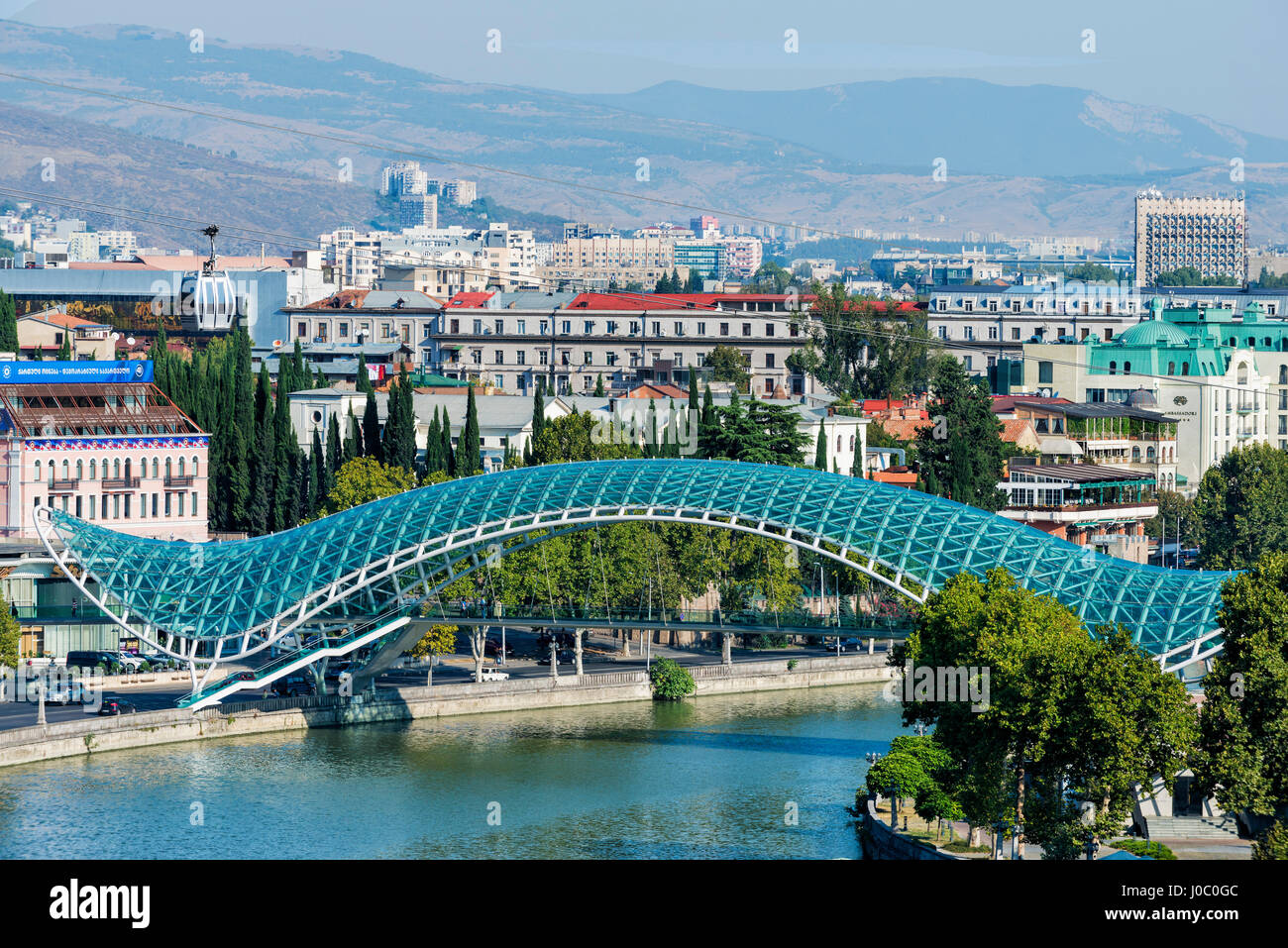 Peace Bridge over the Mtkvari Rver, designed by Italian architect Michele de Lucci, Tbilisi, Georgia, Caucasus, Asia Stock Photo