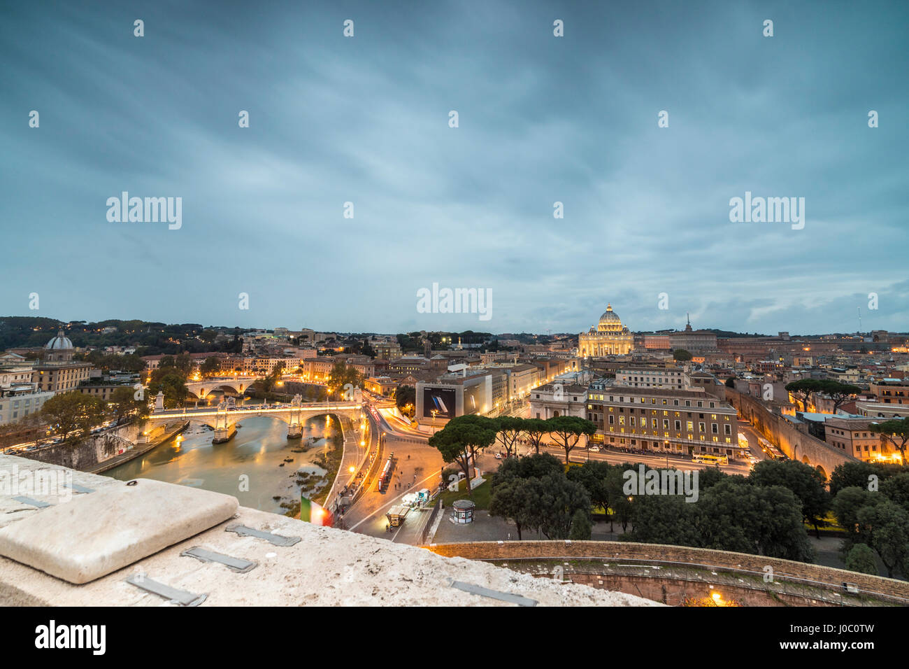 Dusk lights on Lungo Tevere with the Basilica di San Pietro in the background, Rome, Lazio, Italy Stock Photo