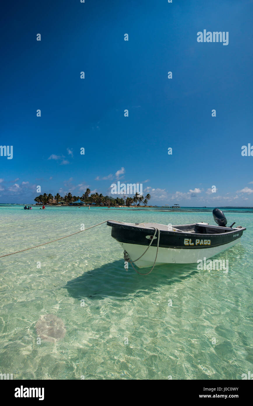 Motorboat anchoring in the turquoise waters of El Acuario, San Andres, Caribbean Sea, Colombia Stock Photo