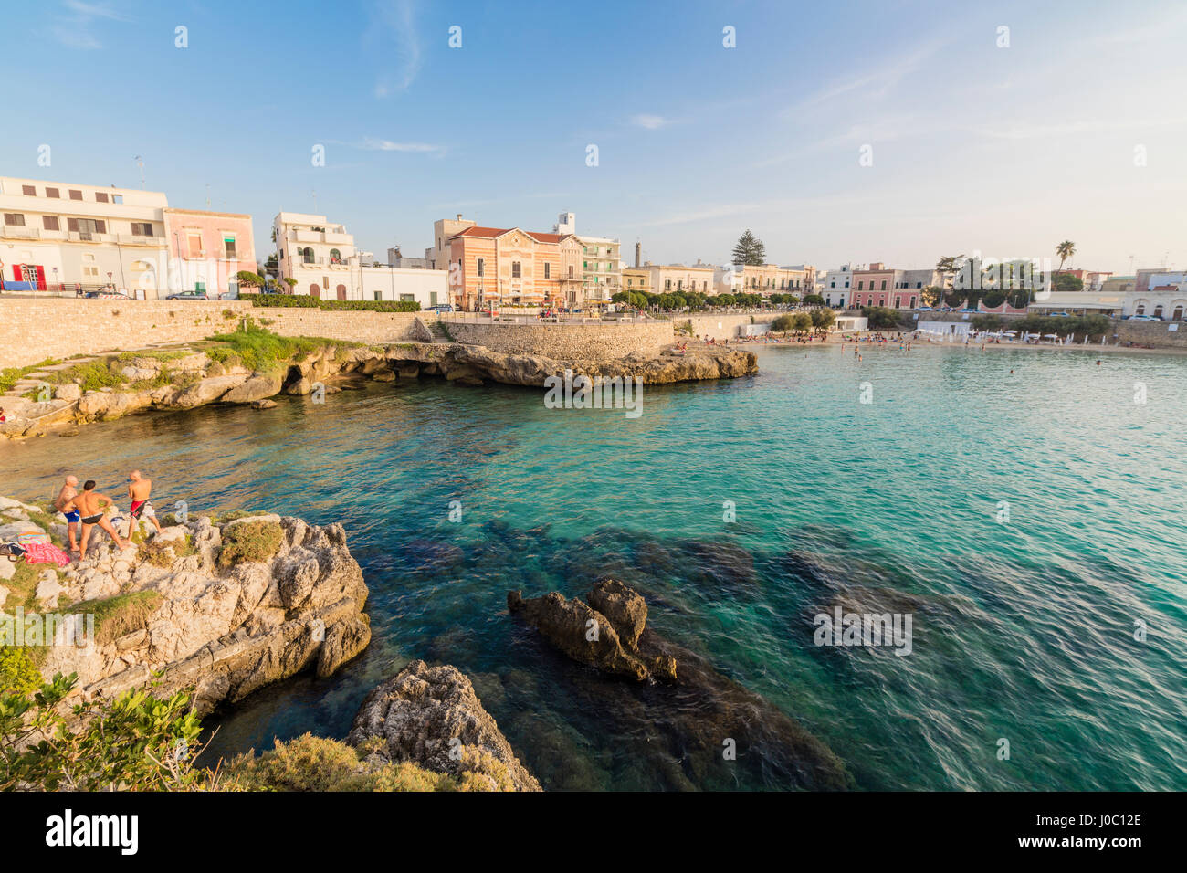 Turquoise sea and cliffs frame the fishing village of Santa Maria al Bagno Gallipoli, Province of Lecce, Apulia, Italy Stock Photo