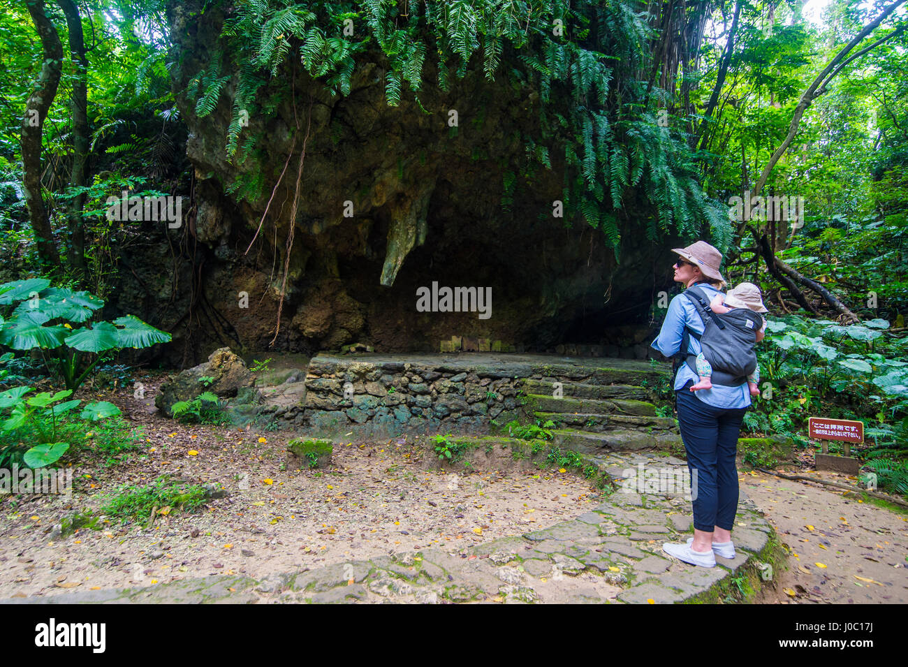 Woman with a baby hiking in the Sacred site of Sefa Utaki, UNESCO World Heritage Site, Okinawa, Japan, Asia Stock Photo