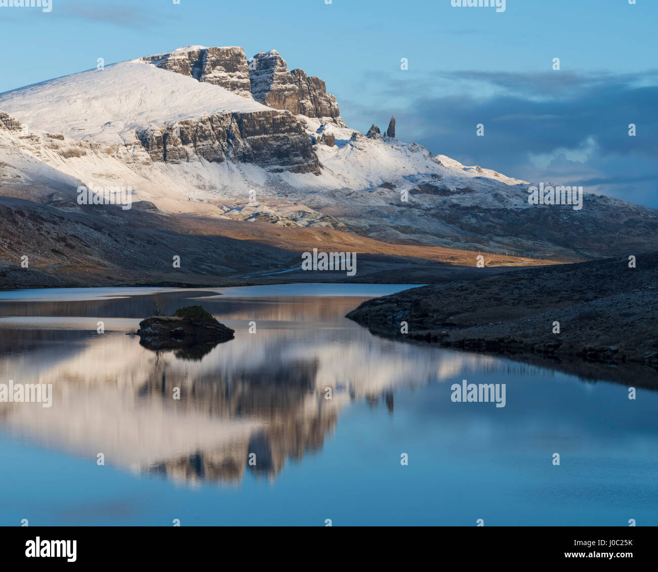 The Storr reflected in the calm waters of Loch Fada on a winter morning, Isle of Skye, Inner Hebrides, Scotland, UK Stock Photo