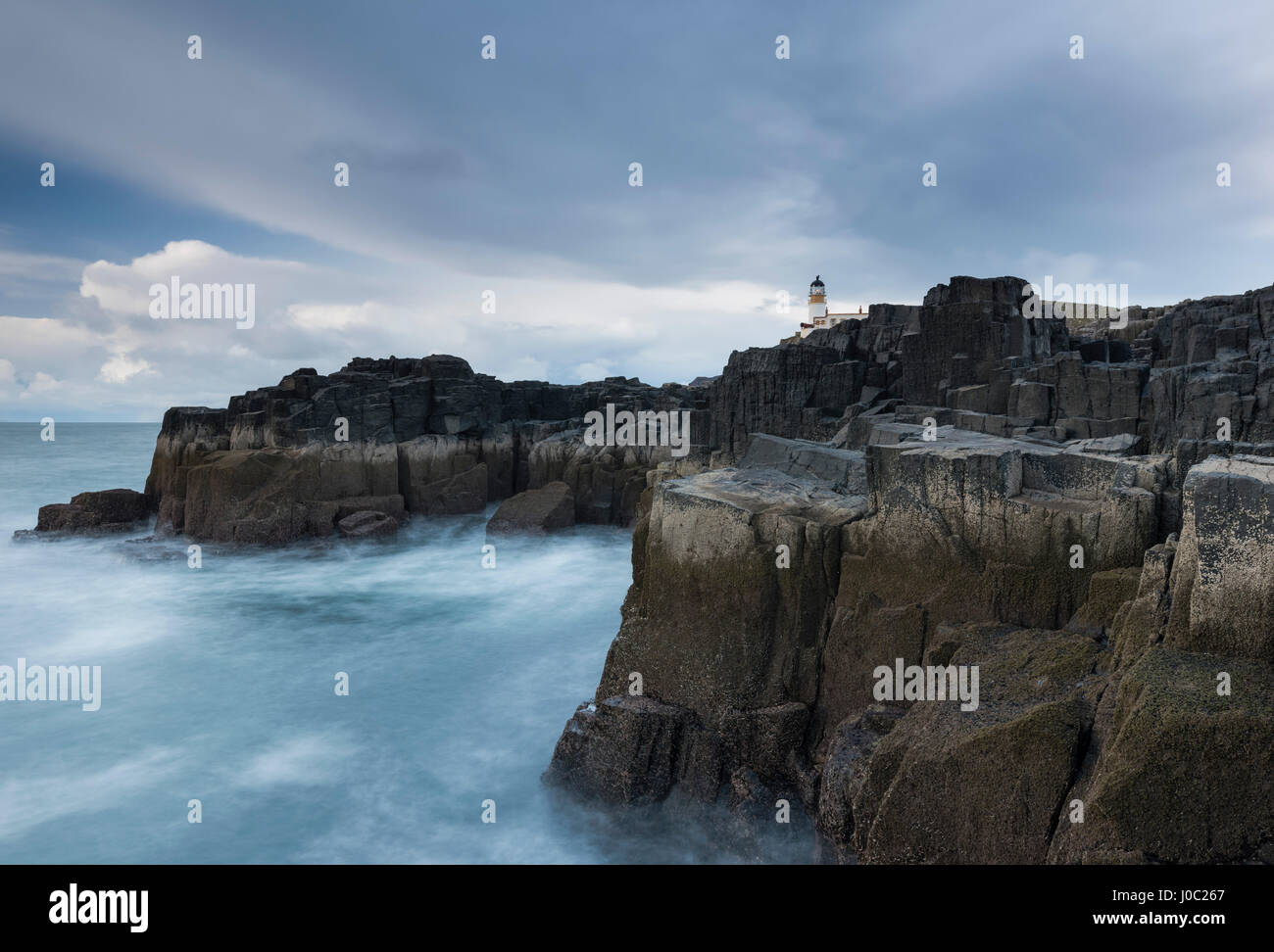 The dramatic coastline and lighthouse at Neist Point, Isle of Skye, Inner Hebrides, Scotland, UK Stock Photo