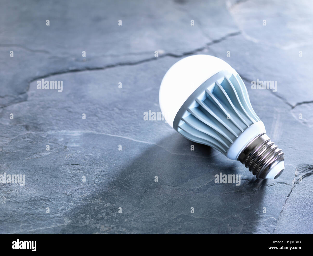 LED energy efficient light bulb, illuminated Stock Photo