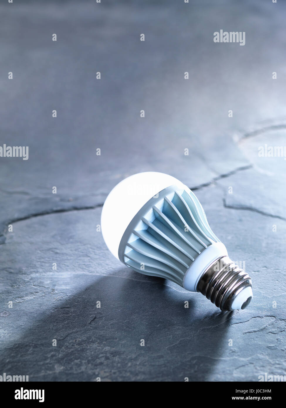LED energy efficient light bulb, illuminated Stock Photo Alamy