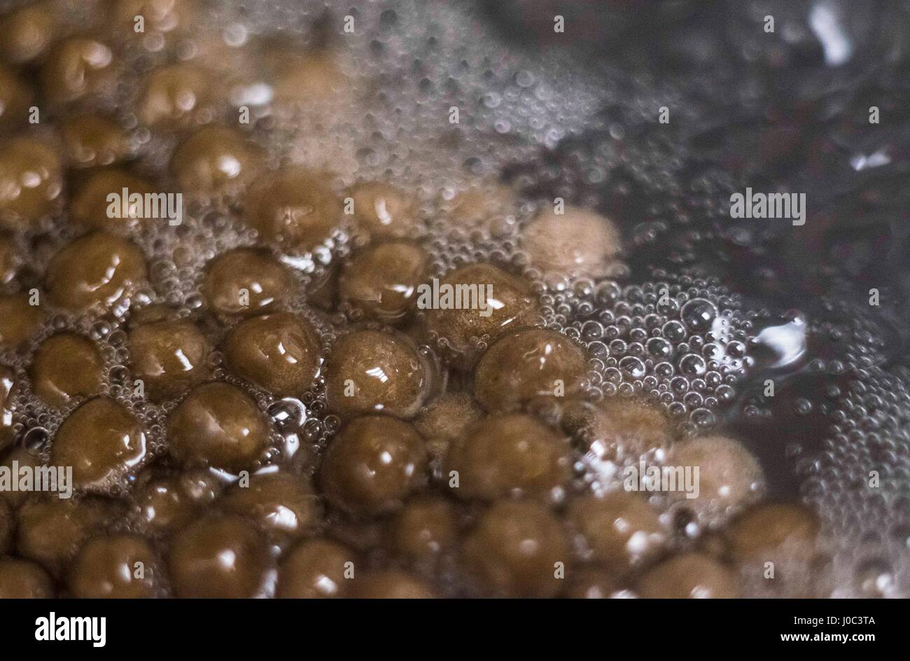 A series of twelve close up macro photos detailing making Bubble Tea or Boba Tea. Taiwan is the birthplace of the phenomenon that is Bubble Tea. Stock Photo