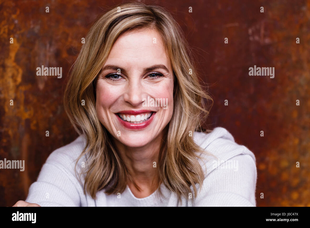 Portrait of mid adult woman, smiling Stock Photo