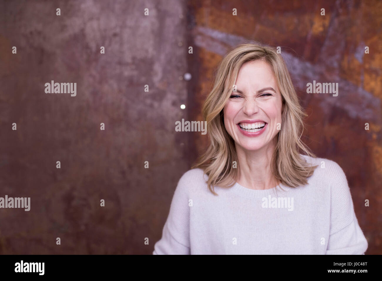 Portrait of mid adult woman, smiling Stock Photo