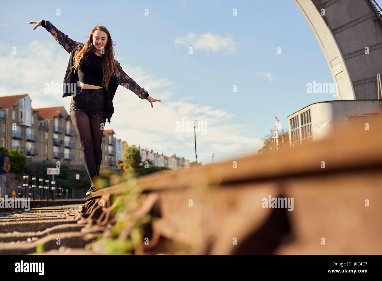 Woman balancing on train track hi-res stock photography and images - Alamy