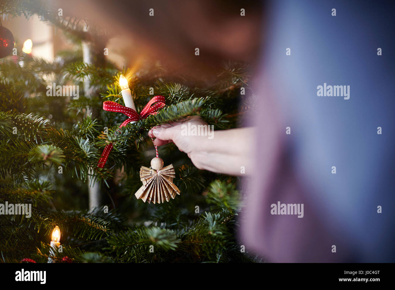 Woman illuminated christmas tree hi-res stock photography and images ...