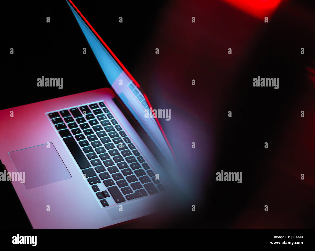 Cyber attack, laptop computer being infected by virus Stock Photo