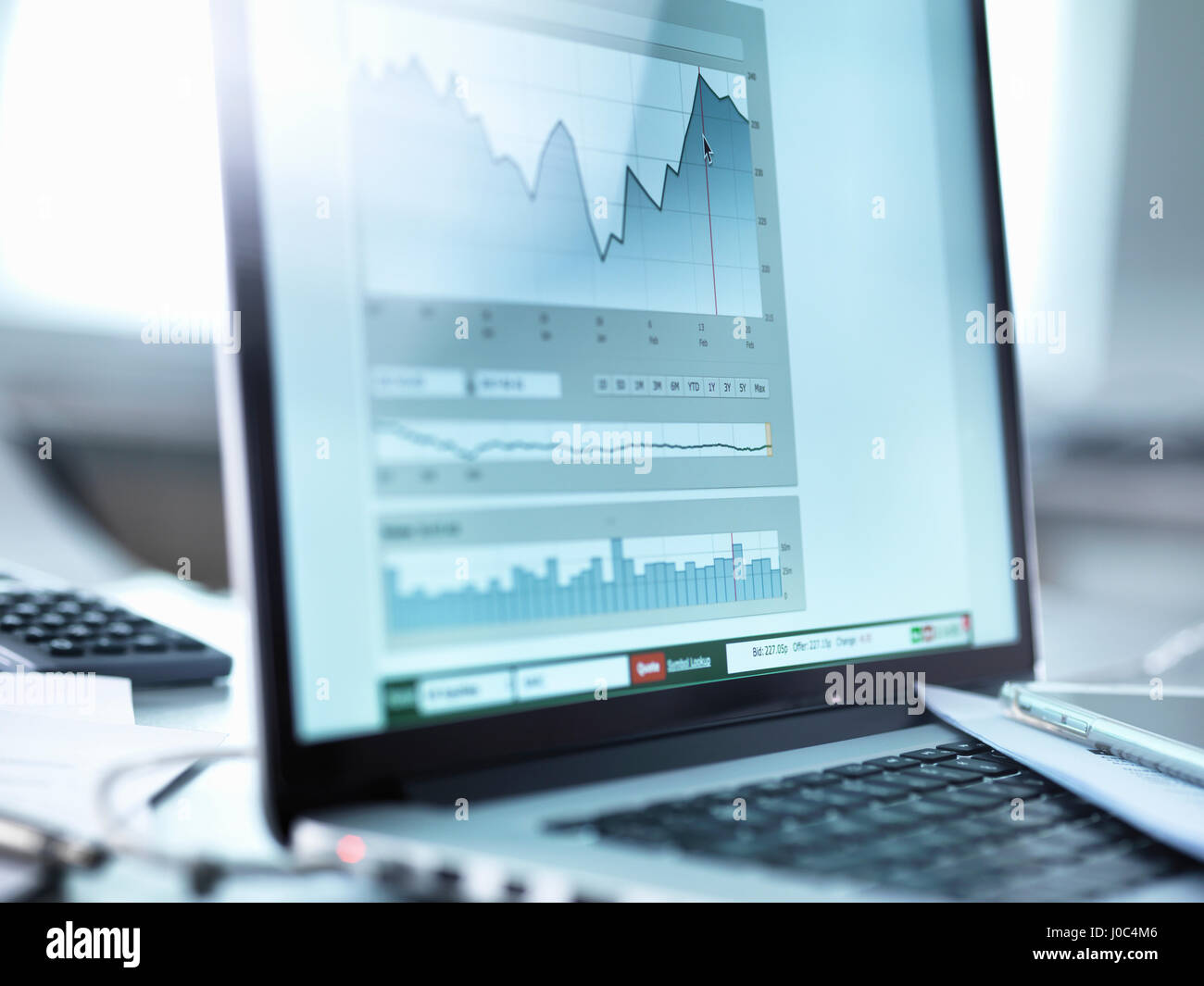 Share price data from investor's portfolio on a laptop computer screen Stock Photo