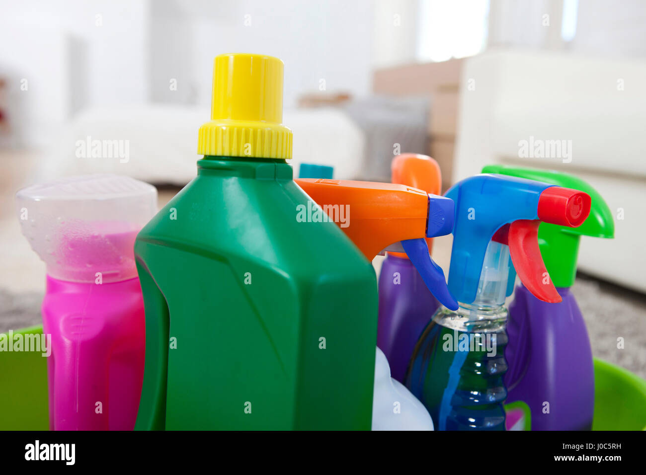 Colourful cleaning product plastic bottles and sprays on kitchen counter Stock Photo Alamy