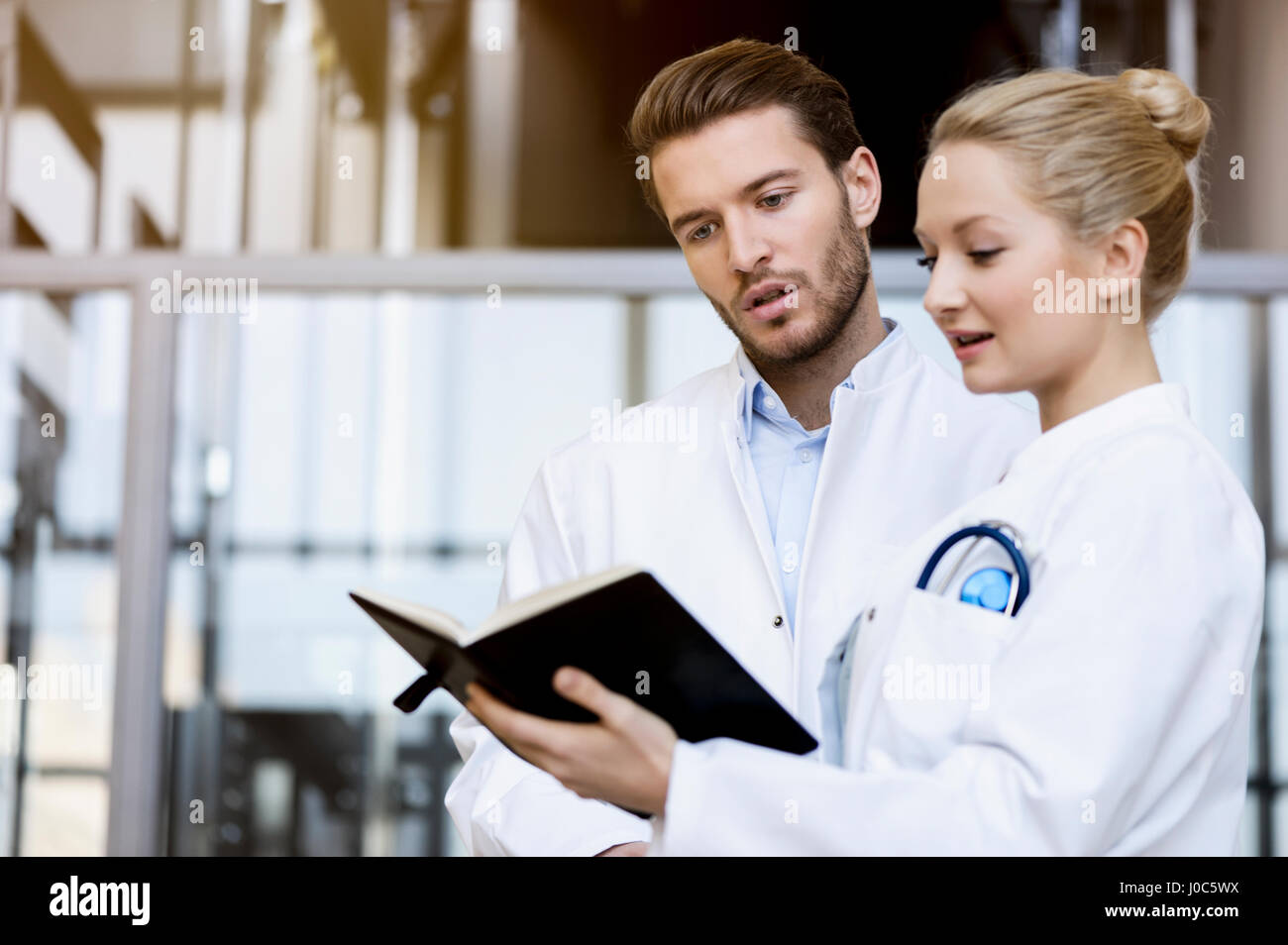 Two doctors looking at diary Stock Photo