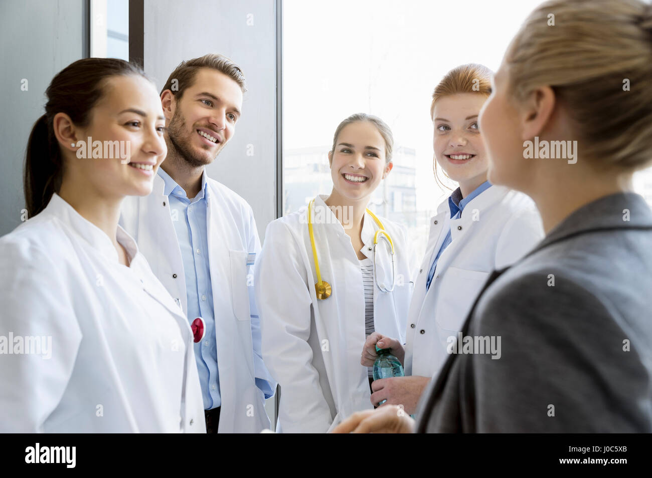 Group of doctors having discussion with consultant Stock Photo