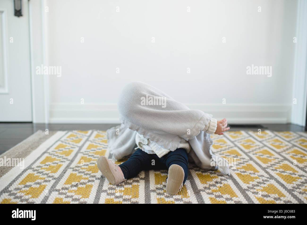 Girl hiding under blanket hires stock photography and images Alamy