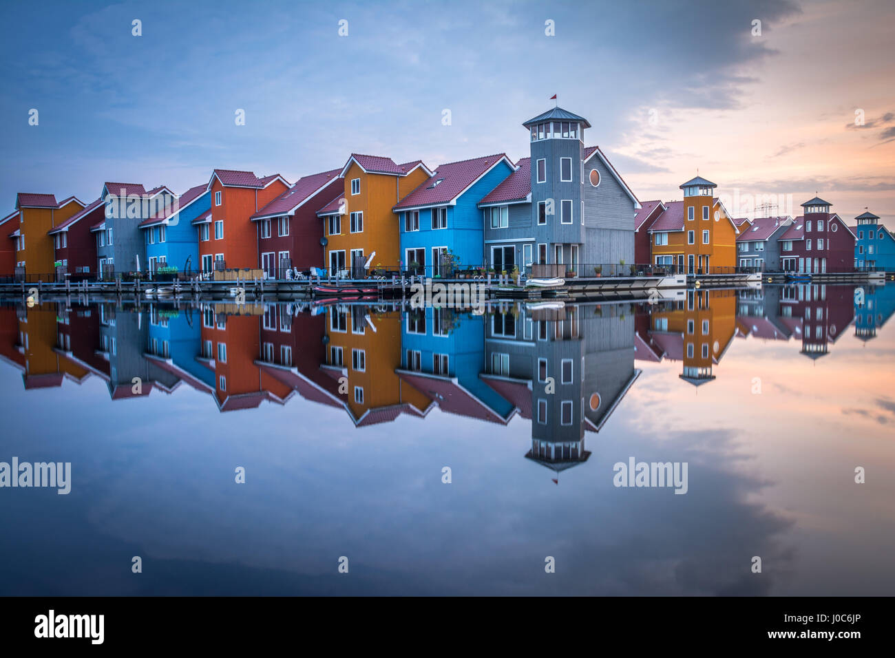 Colorful houses reflected in the water in Groningen, Reitdiephaven, The