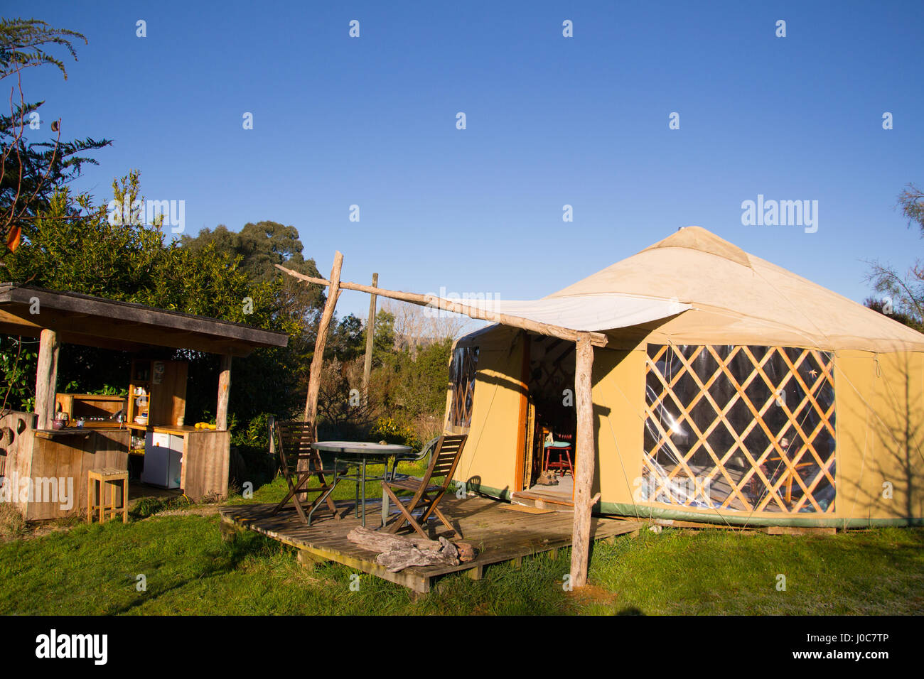 A beautiful yurt and outdoor kitchen on a sunny day in rural New Zealand. Stock Photo