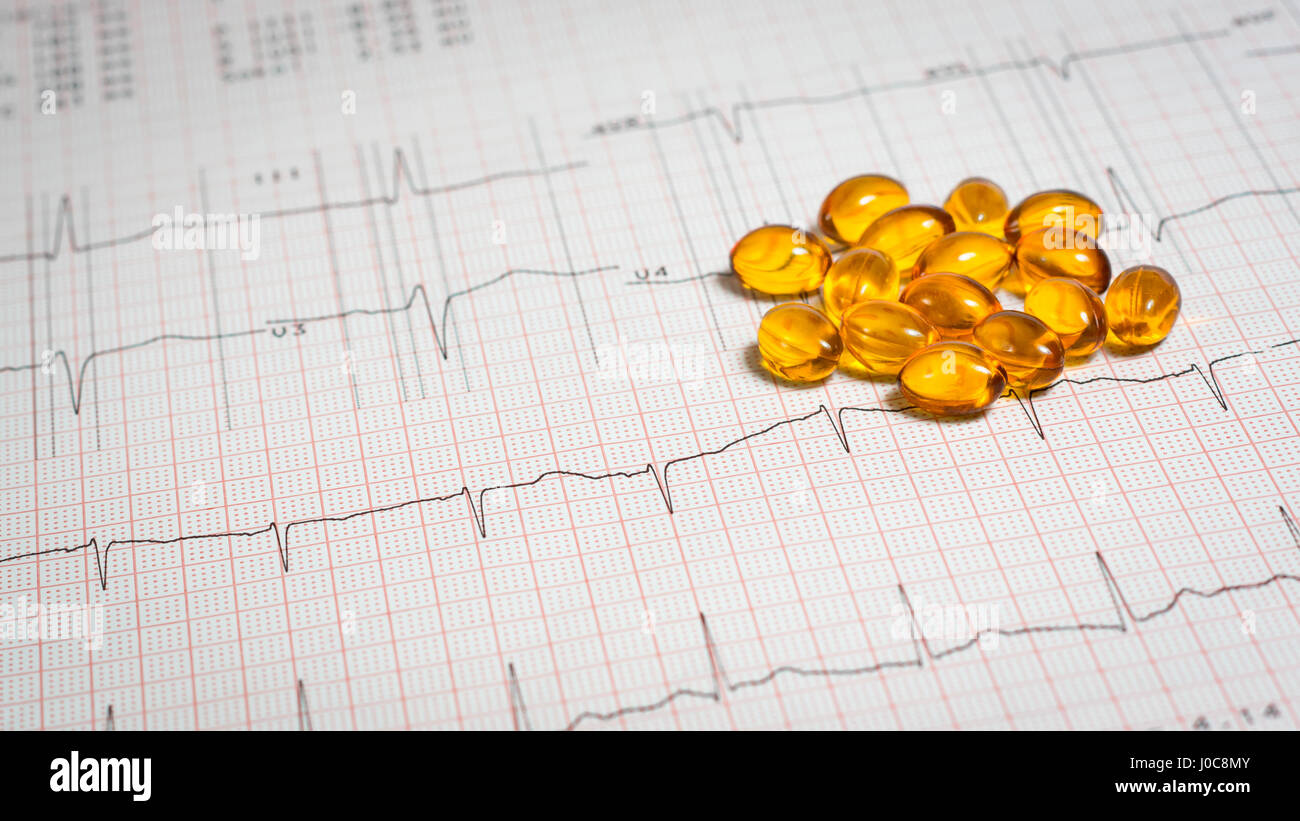 vitamin D placed on an EKG test result - Electrocardiogram Stock Photo