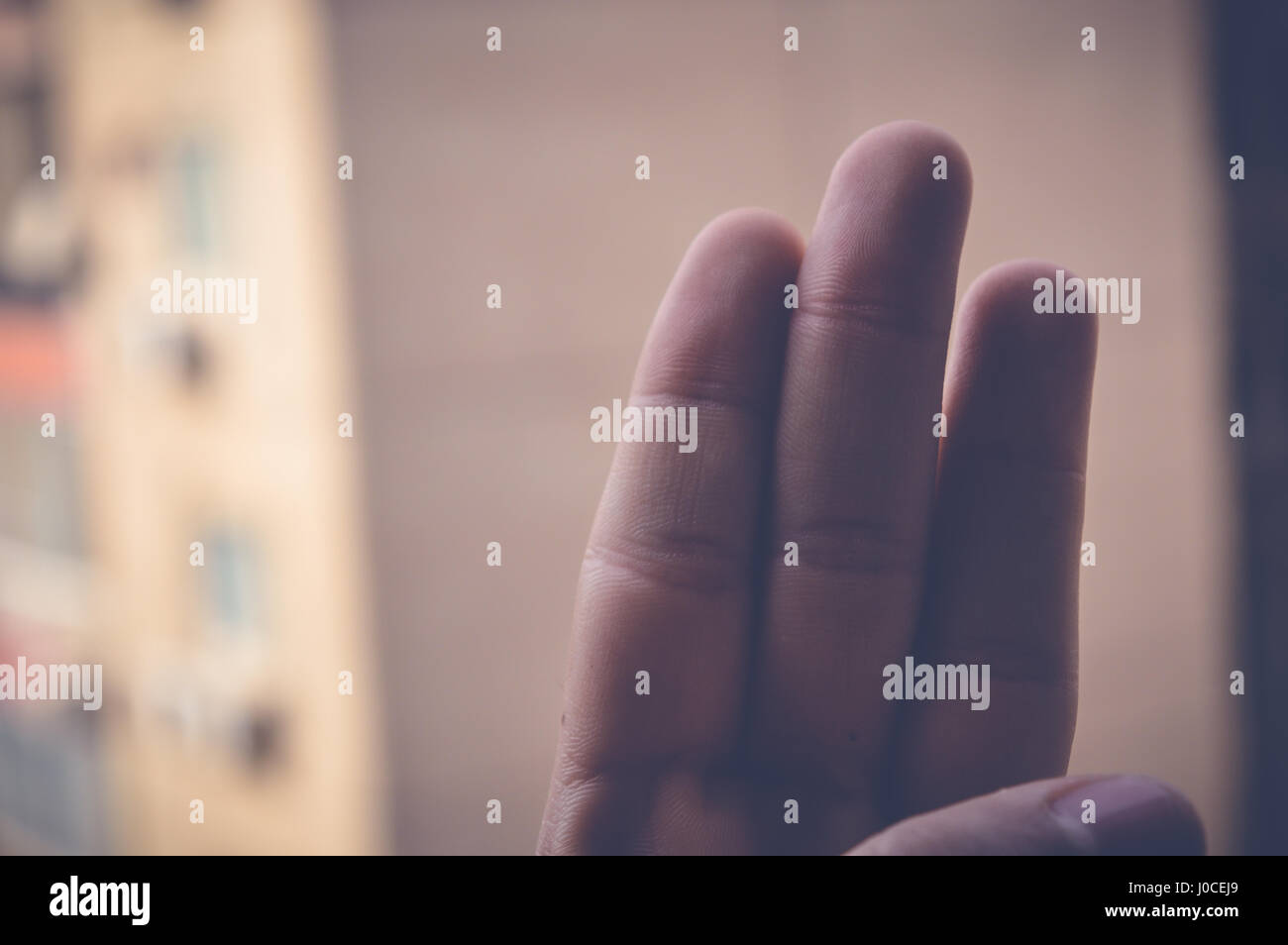three fingers hand sign Stock Photo - Alamy