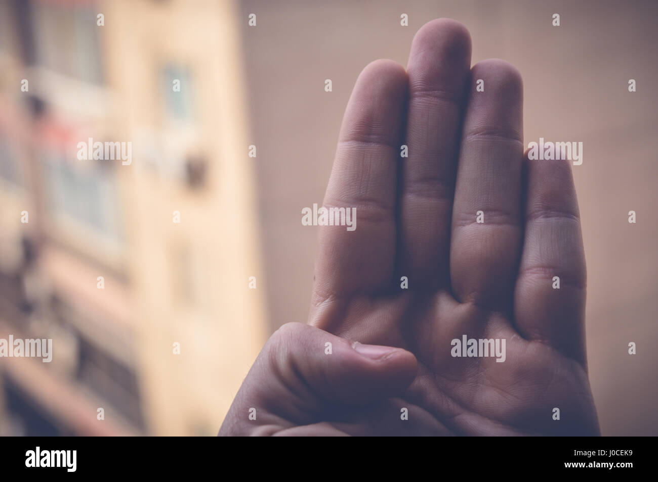 four fingers hand sign Stock Photo Alamy