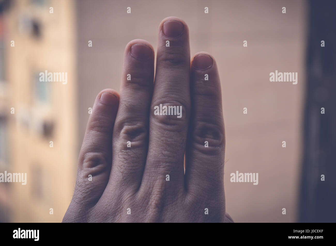 four fingers hand sign Stock Photo Alamy
