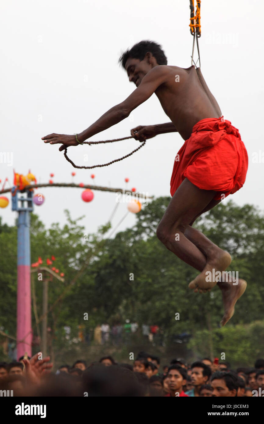 Devotees hanging rope hooks on back hi-res stock photography and images -  Alamy