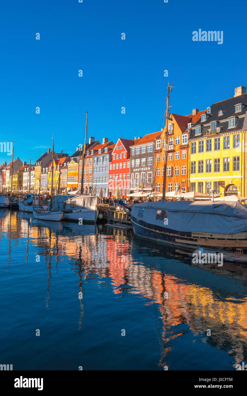 COPENHAGEN, DENMARK - MARCH 11, 2017: Copenhagen Nyhavn canal and promenade with its colorful facades, 17th century waterfront is an entertainment dis Stock Photo