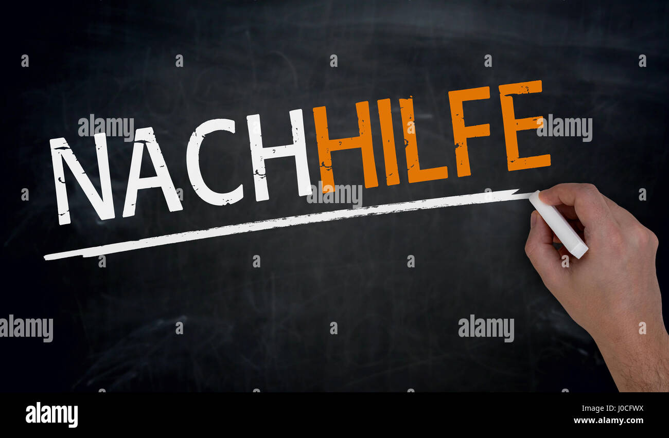 Nachhilfe (in german Tutoring) is written by hand on blackboard. Stock Photo