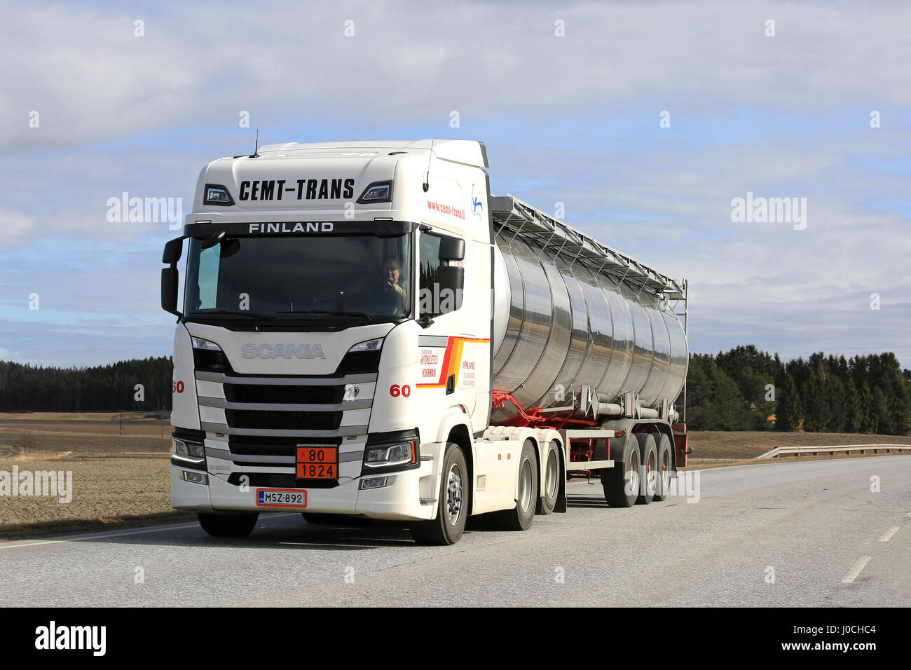SALO, FINLAND - APRIL 8, 2017: White Next Generation Scania R500 semi tanker for ADR haul of Cemt-Trans moves along highway on a beautiful day of spri Stock Photo