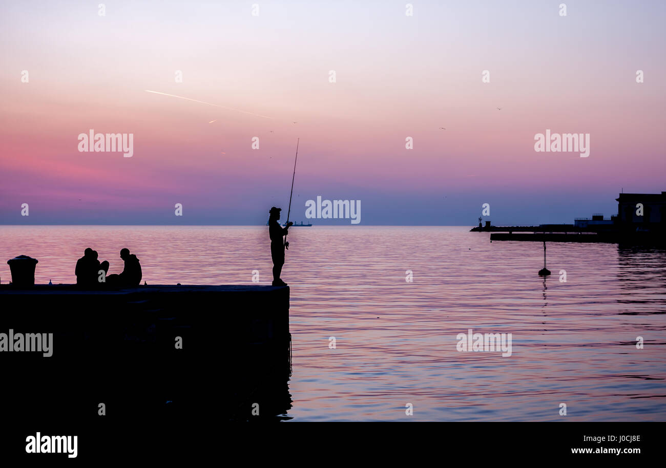 Silhouette Fisherman On Pier Sunset High Resolution Stock Photography ...