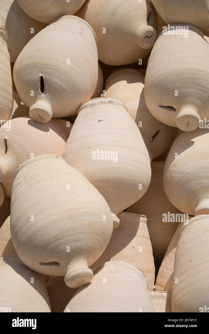 Clay water pots in a pile, A'ali, Bahrain Stock Photo