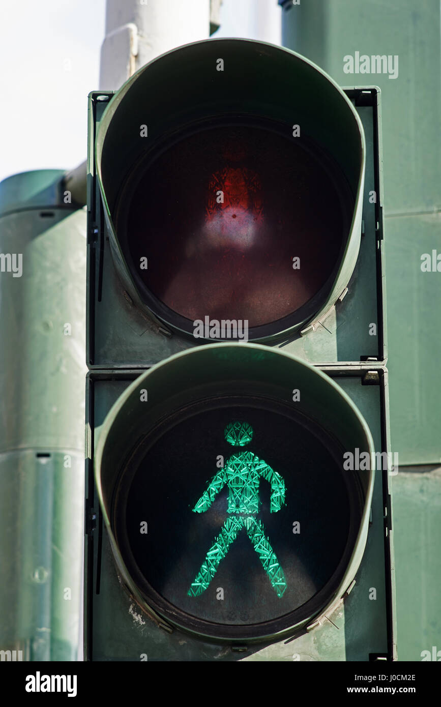Traffic light with the green man sympol. Stock Photo