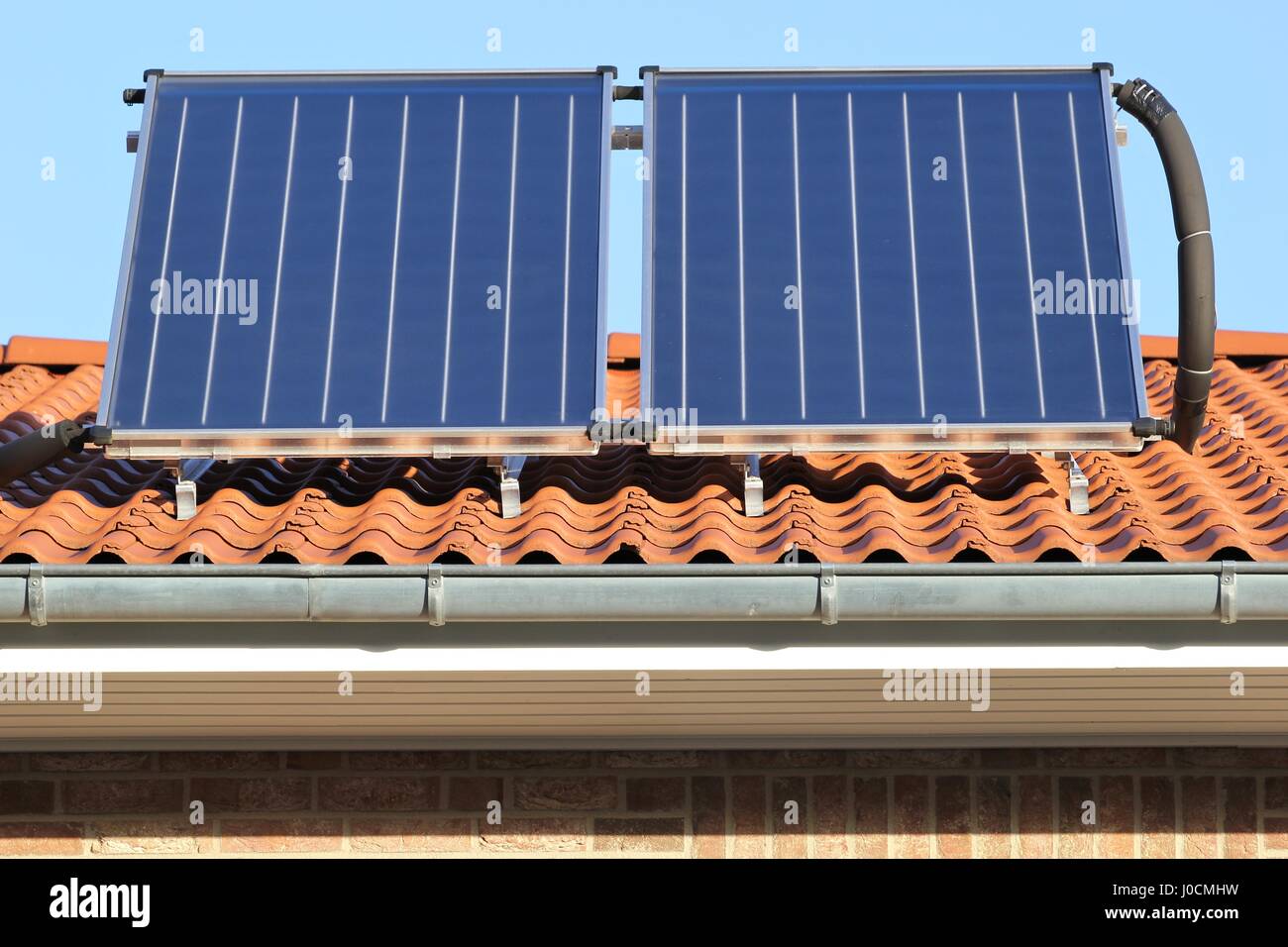 building-mounted solar thermal collectors Stock Photo