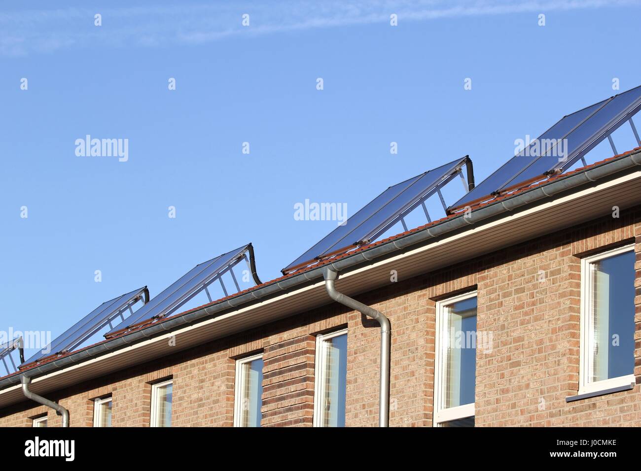 building-mounted solar thermal collectors Stock Photo
