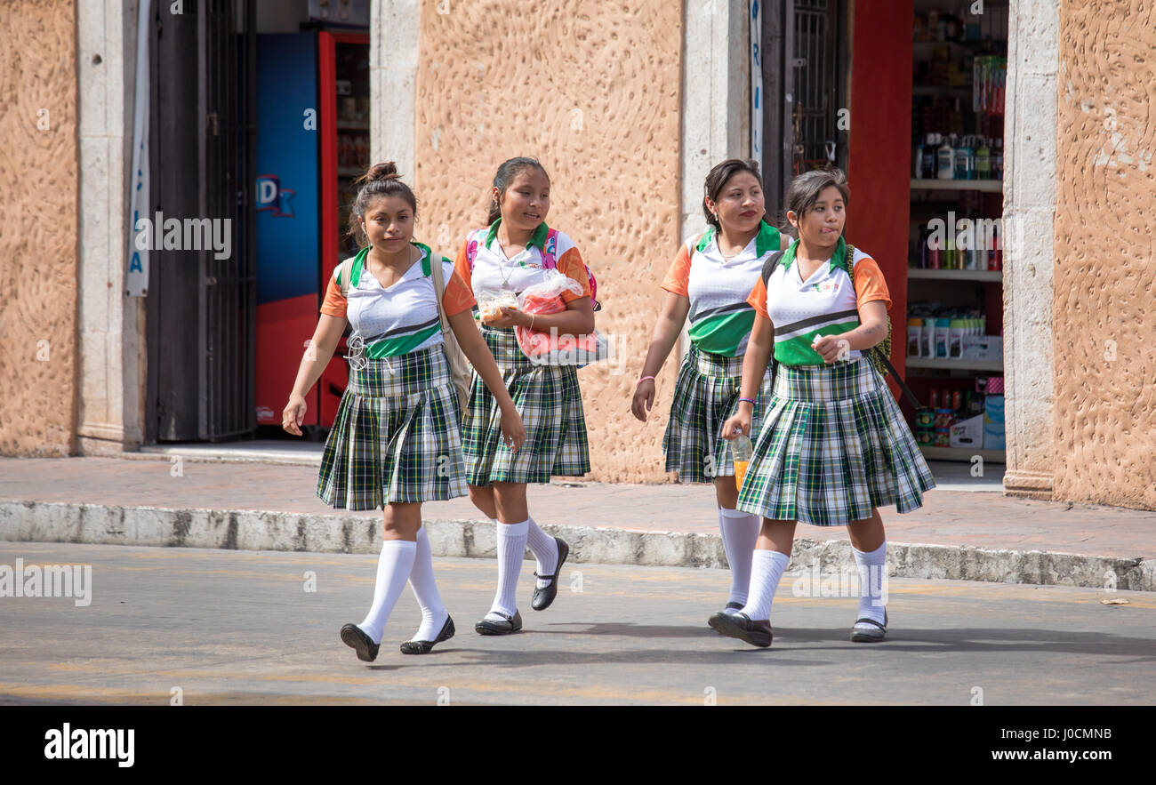 Valladolid, Mexico - Mar 14, 2017: Young girls in school uniform walking home after school hours. Stock Photo