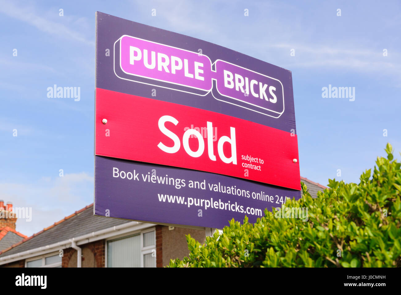 Purple Bricks Group PLC estate agents sold sign the company is the UKs first online property agent launched in 2014 Stock Photo