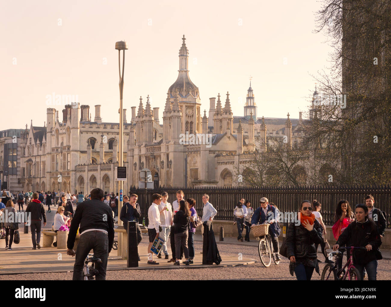 Cambridge city centre, - Cambridge University students  on Kings Parade, and Kings College Cambridge university at sunset, Cambridge UK Stock Photo