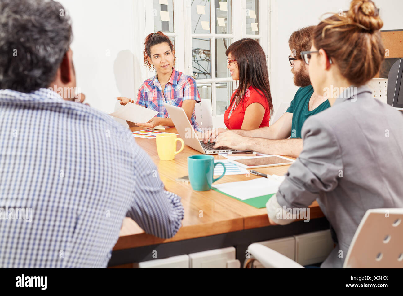 Business people in creative meeting as a team Stock Photo