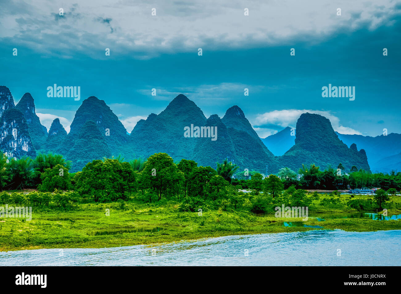 Karst mountains and Lijiang River scenery in the mist Stock Photo