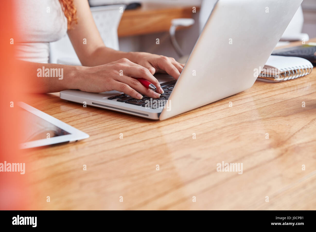 Woman in computer training learns with laptop Stock Photo
