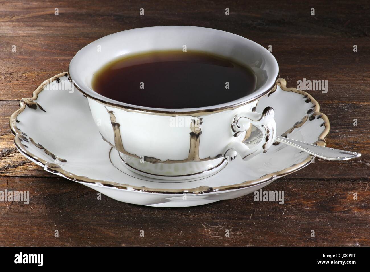 black tea in a beautiful ancient cup of the mid 19th century Stock Photo